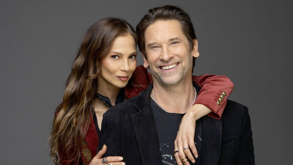 Tamara Braun with her arm on Roger Howarth's shoulder of The Young and the Restless