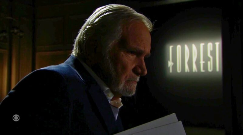 Eric holds his designs near the Forrester runway on The Bold and the Beautiful recap