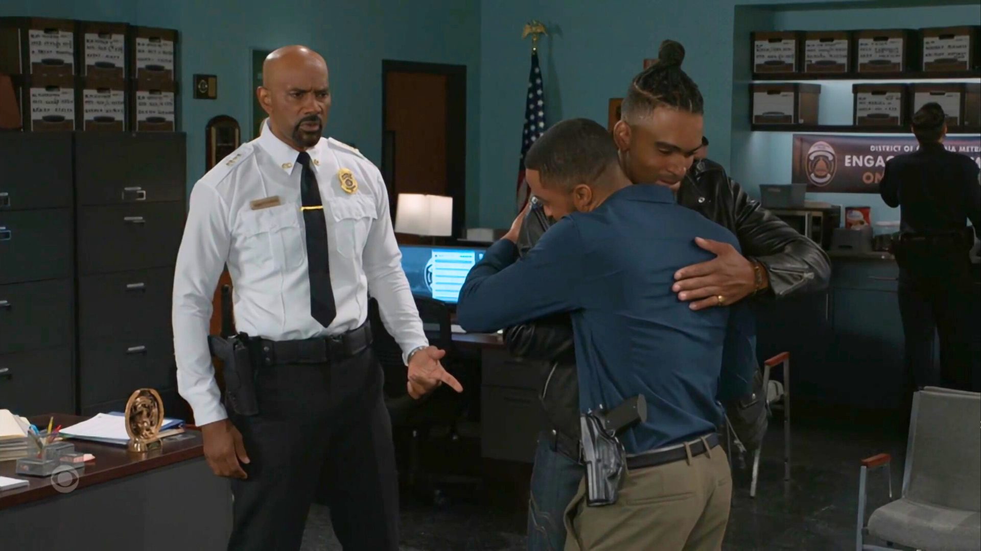 The Hawthorne men at the police station on Beyond the Gates | Photo: CBS