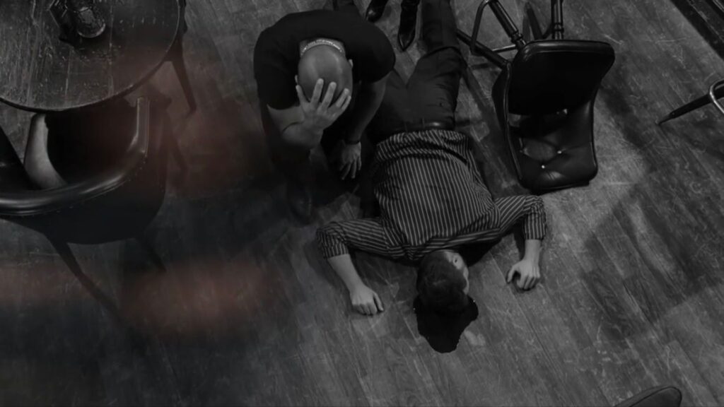 Holden kneels over a dead man's body on The Young and the Restless recap