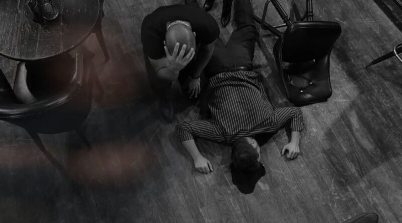 Holden kneels over a dead man's body on The Young and the Restless recap