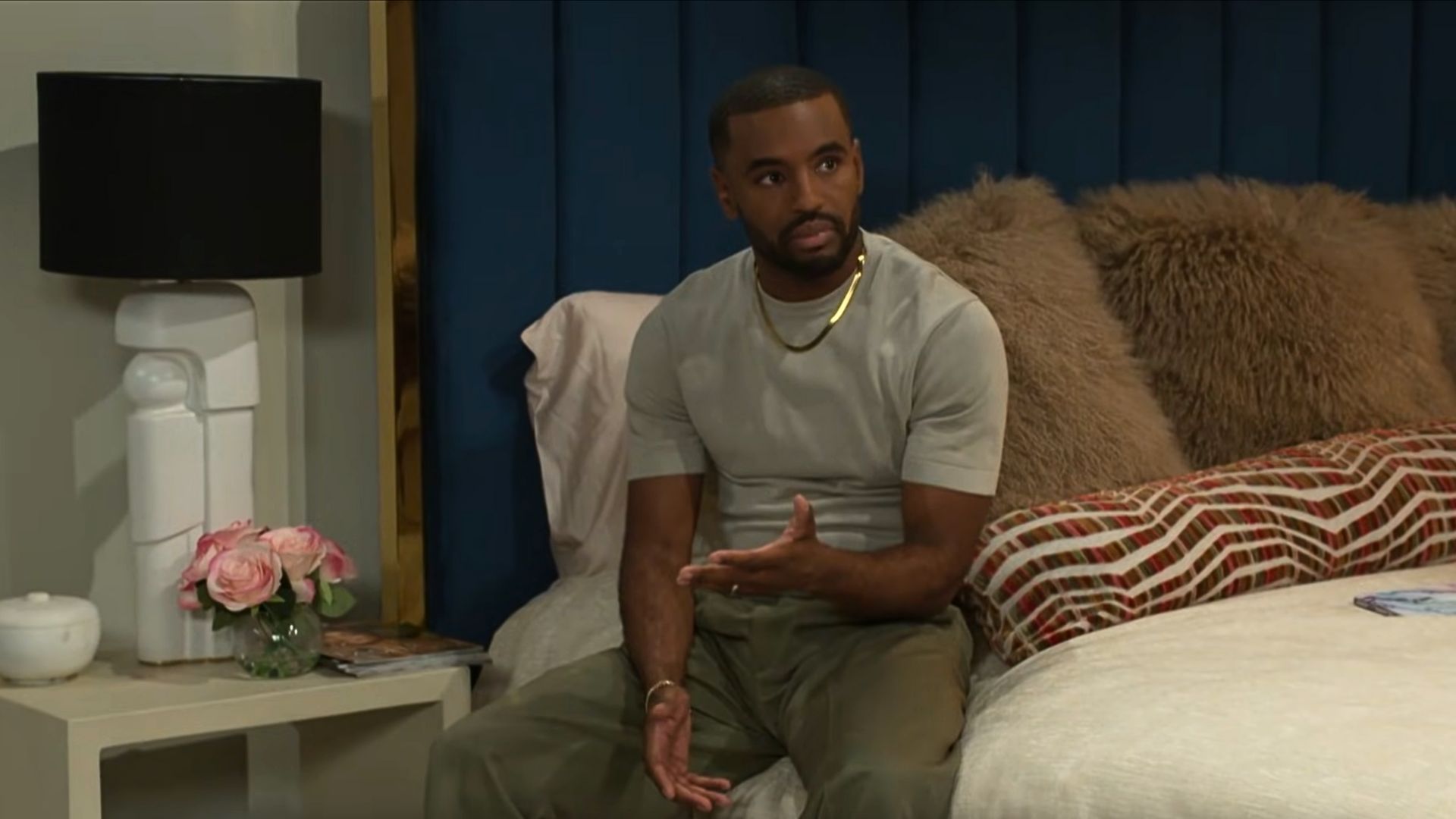 Andre sitting on the bed at home on Beyond the Gates recap